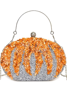 Elegant pumpkin-shaped evening clutch bag with orange and silver sequins and metal handle