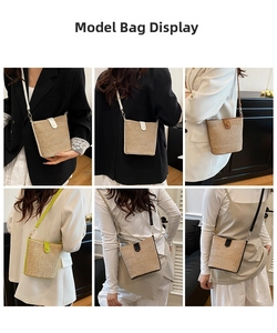Detail view of woven straw bucket bag showing leather trim and shoulder strap options