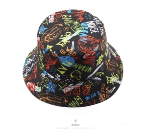 Top view of reversible bucket hat featuring vibrant graffiti prints and urban text details
