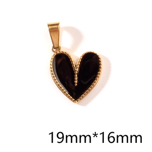 Macro detail of a 19mm*16mm golden heart pendant with black enamel inlay on white background