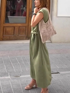 Elegant olive green sleeveless midi dress with waist tie and crochet shoulder bag