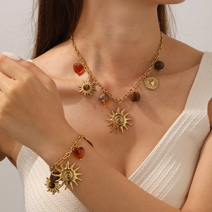 Vintage gold plated sun pendant necklace and bracelet set with amber heart beads
