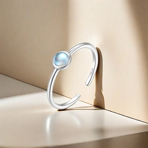 Detail of S925 sterling silver adjustable ring featuring a round moonstone cabochon