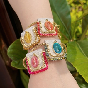 Set of four handmade religious bead bracelets with colorful virgin mary charms