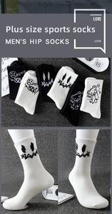 Detailed view of knitted cotton crew socks with street style smile and bear embroidery