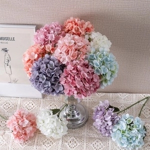 Artistic arrangement of faux hydrangea flowers in diverse colors for interior decoration