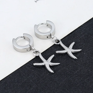 Polished silver starfish hoop earrings with high-detail ocean-inspired metallic texture