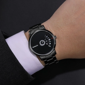 Detailed view of fashion rotating dial quartz watch with black steel strap on wrist