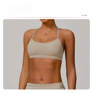 Detailed view of U-neckline on light khaki sports bra with thin shoulder straps