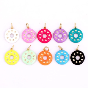 Detailed flat lay of colorful mini donut charms with cubic zirconia for DIY jewelry