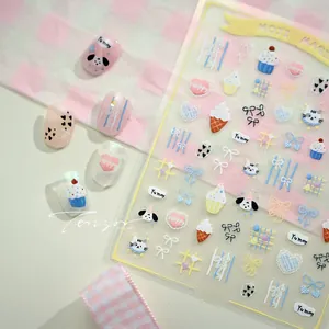 Detail of KX480 nail art stickers featuring cute cartoon dogs and macaron dessert patterns