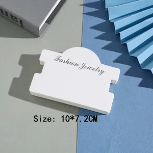 Close-up of white paper jewelry display card sized 10x7.2cm with Fashion Jewelry text