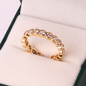 Close-up of 18k gold plated ring with sparkling zircons set in a velvet jewelry box