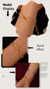 Detail view of geometric link chain bracelets in gold and silver finish with lobster clasp