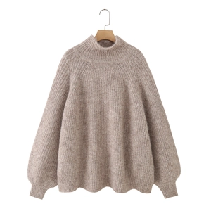 Detail view of oatmeal alpaca blend knit sweater featuring mock neck and raglan sleeves