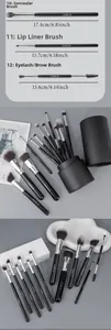 Detail of concealer, lip and eyelash brushes with dimensions in a black leather case