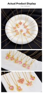 Macro display of pink heart crystal pendants with gold chains and bow-knot design details