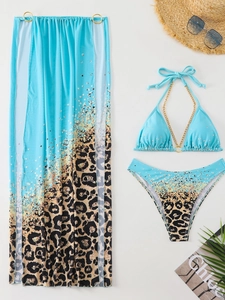 Three-piece leopard print bikini set with blue gradient mesh skirt and gold chain details