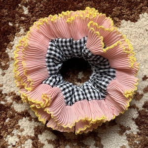 Pink pleated scrunchie with yellow lace trim and black white checkered pattern detail