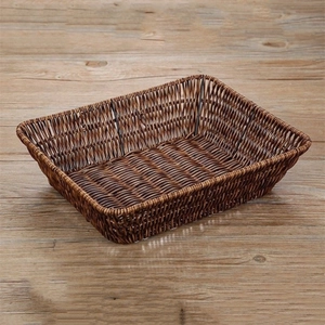 Macro shot of brown rectangular woven bread basket with detailed texture on wood surface