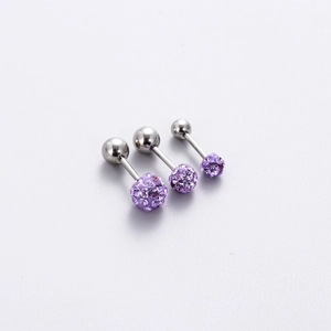 Detailed view of titanium steel ear studs with purple crystal balls in three various sizes