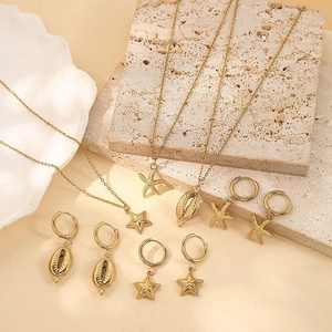 Bohemian gold starfish and seashell jewelry set including necklaces and hoop earrings