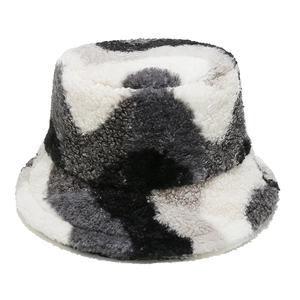 Detail of multi-color thick fleece bucket hat with a camouflage pattern in grey and black