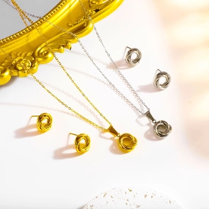 Parure collier et boucles d'oreilles Mobius torsadée minimaliste en or et argent