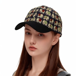 Detailed view of elephant print baseball cap featuring decorative red and green accents