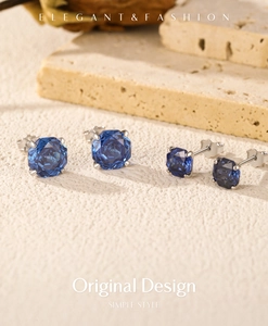 Elegant royal blue octagon rose cut silver stud earrings on a natural stone surface