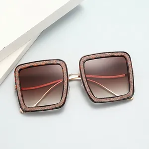 Elegant square tortoiseshell sunglasses for women with gold metal temples and gradient lenses