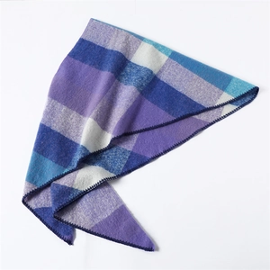Close-up of blue and purple plaid scarf showing soft fabric texture and stitched edges