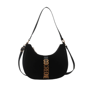 Large black velvet hobo bag with golden metallic COCREONE letters on a white background