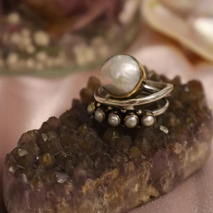 Vintage style open rings set with large baroque pearl and silver finish accents