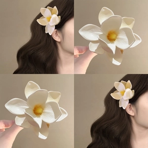 Elegant white frangipani fabric flower hair clip with yellow stamens for women's styling
