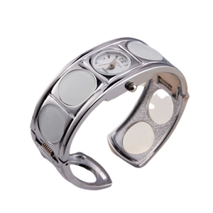 Elegant silver bangle quartz watch for women featuring a white dial and oval inlay accents