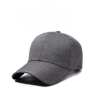 Detail of grey baseball cap featuring 3D CLASS letter embroidery and woven fabric texture