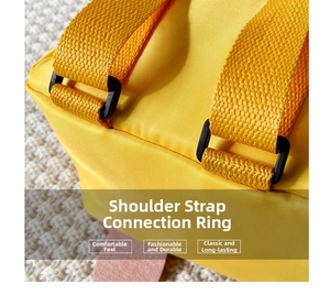 Detail of reinforced yellow strap and plastic buckle on the cartoon duck backpack