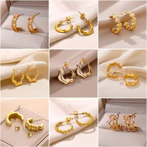 Elegant collection of nine gold-plated C-shaped wavy geometric earrings for women