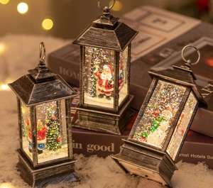 Macro detail of vintage silver Christmas water lantern with Santa Claus and festive glitter