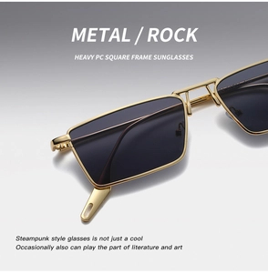 Close-up of golden metal square frame sunglasses featuring heavy PC steampunk details