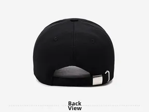 Detail of the back of the black cotton baseball cap showing adjustable metal buckle strap