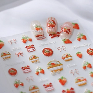 3D embossed strawberry and bow nail art stickers with glossy gold finish on nails