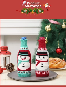 Festive snowman knitted wine bottle cover with scarf detail in a Christmas setting