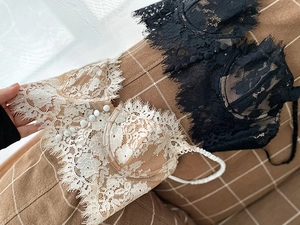 Detailed close-up of lace bralette featuring delicate eyelash lace and mesh texture