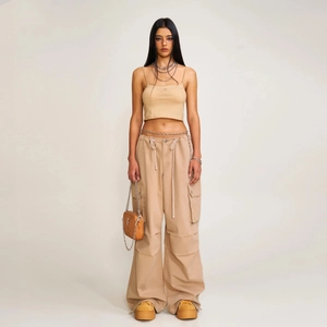 Women khaki drawstring cargo pants and crop top set with orange crossbody bag