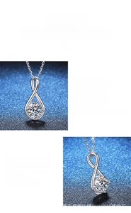 Detail view of knot moissanite pendant showing sparkle and polished silver texture