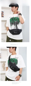 Detail view of black nylon waist bag with multiple zipper pockets and adjustable strap