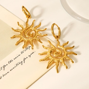 Detailed view of 18K gold stainless steel sun earrings with hammered metal texture