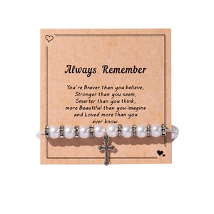 Faux pearl cross pendant bracelet set presented on an inspirational quote gift card
